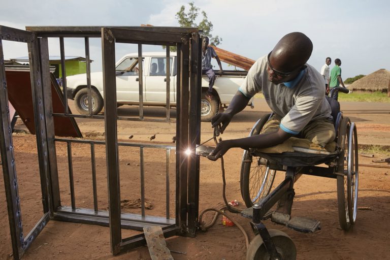 Anaka Oskar Okello, a man with a disability, has a thriving welding business in Uganda. Photo: Jaco Klamer