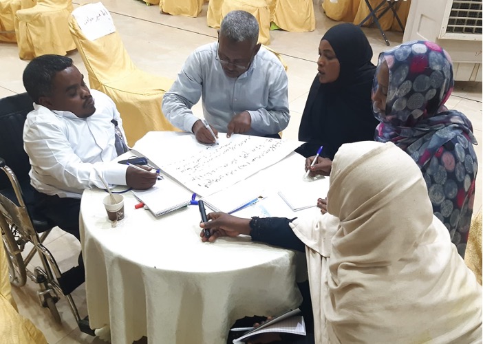 A group of participants including persons with disabilities participating in a group exercise during the We are Able!'s Training of Trainers programme.